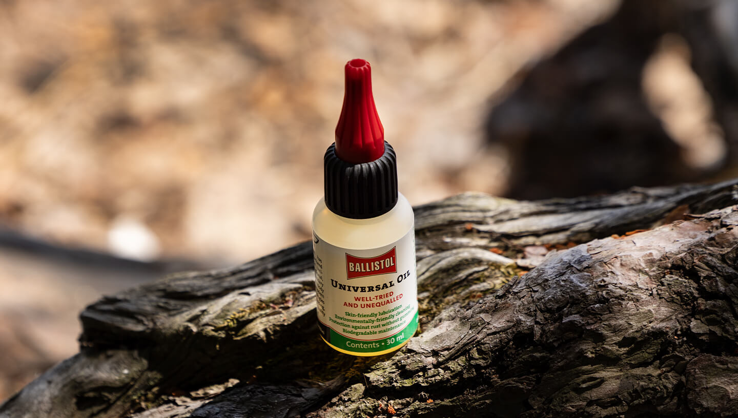 Ballistol Universal Oil bottle and knife sheath in hand